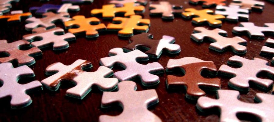 Puzzle pieces on a wooden table